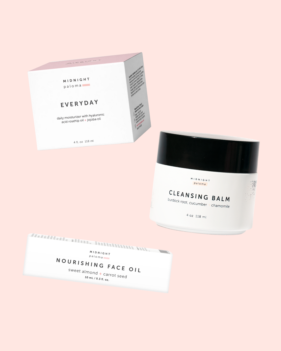 Cleansing balm and face oils with packaging on a pink background