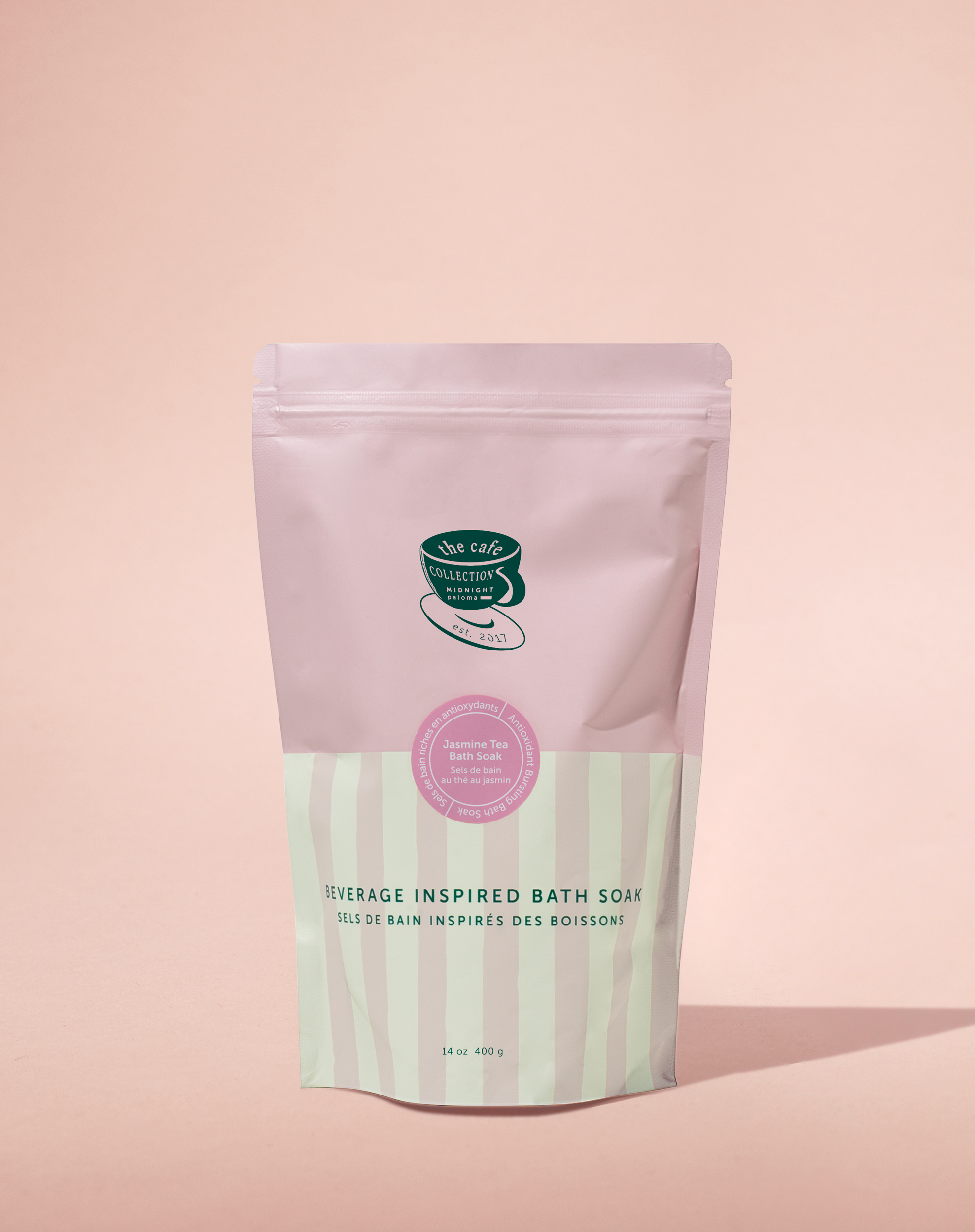 A package of Jasmine Tea Bath Soak with a pink and green label, placed against a neutral background.