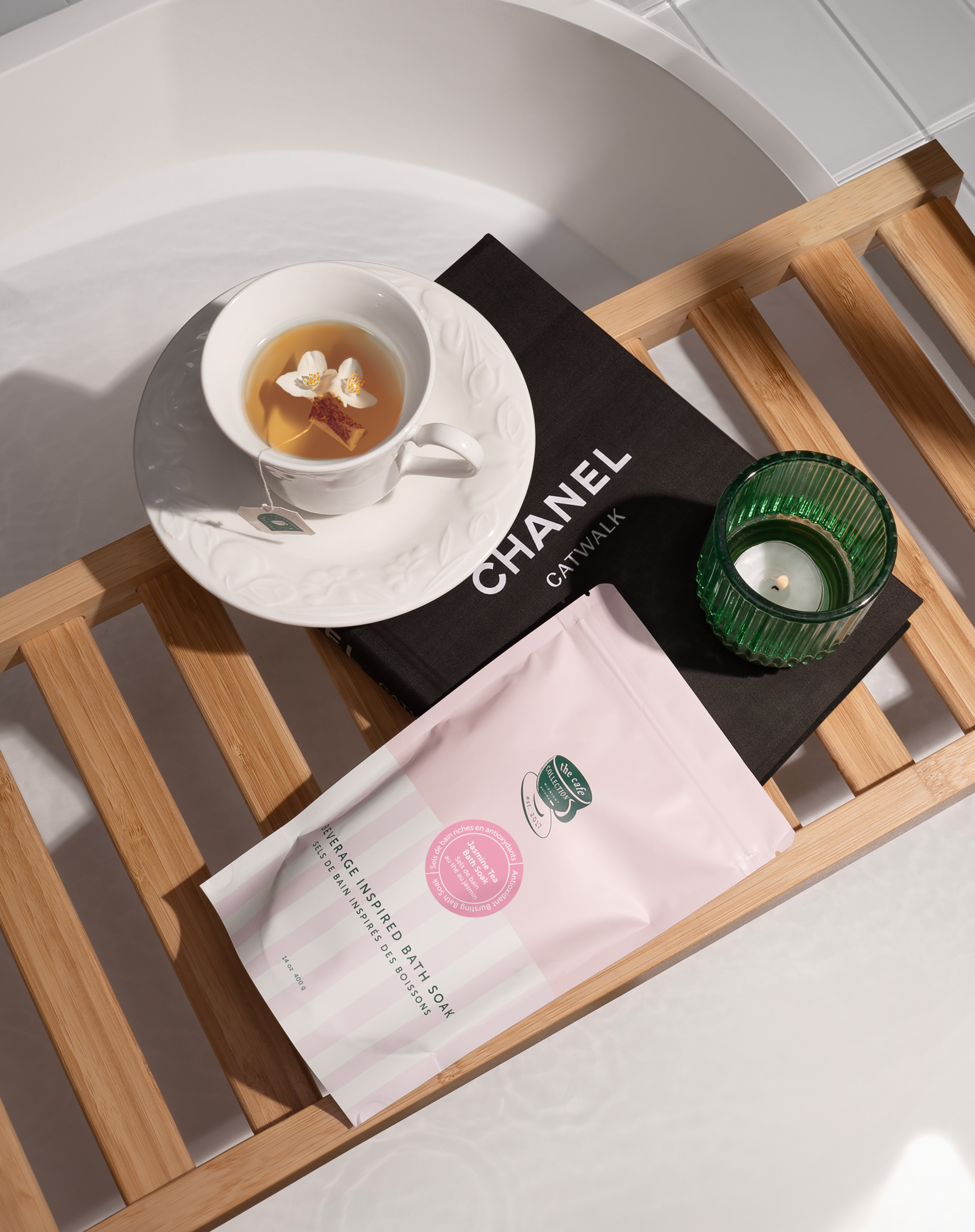 A package of Jasmine Tea Bath Soak with a pink and green label, placed against a neutral background.