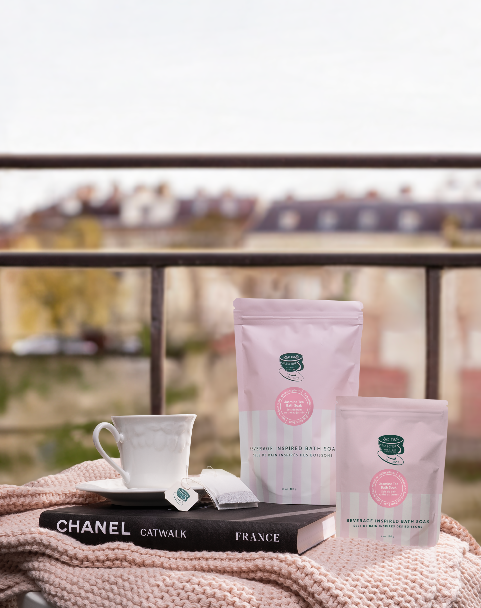 A package of Jasmine Tea Bath Soak with a pink and green label, placed against a neutral background.