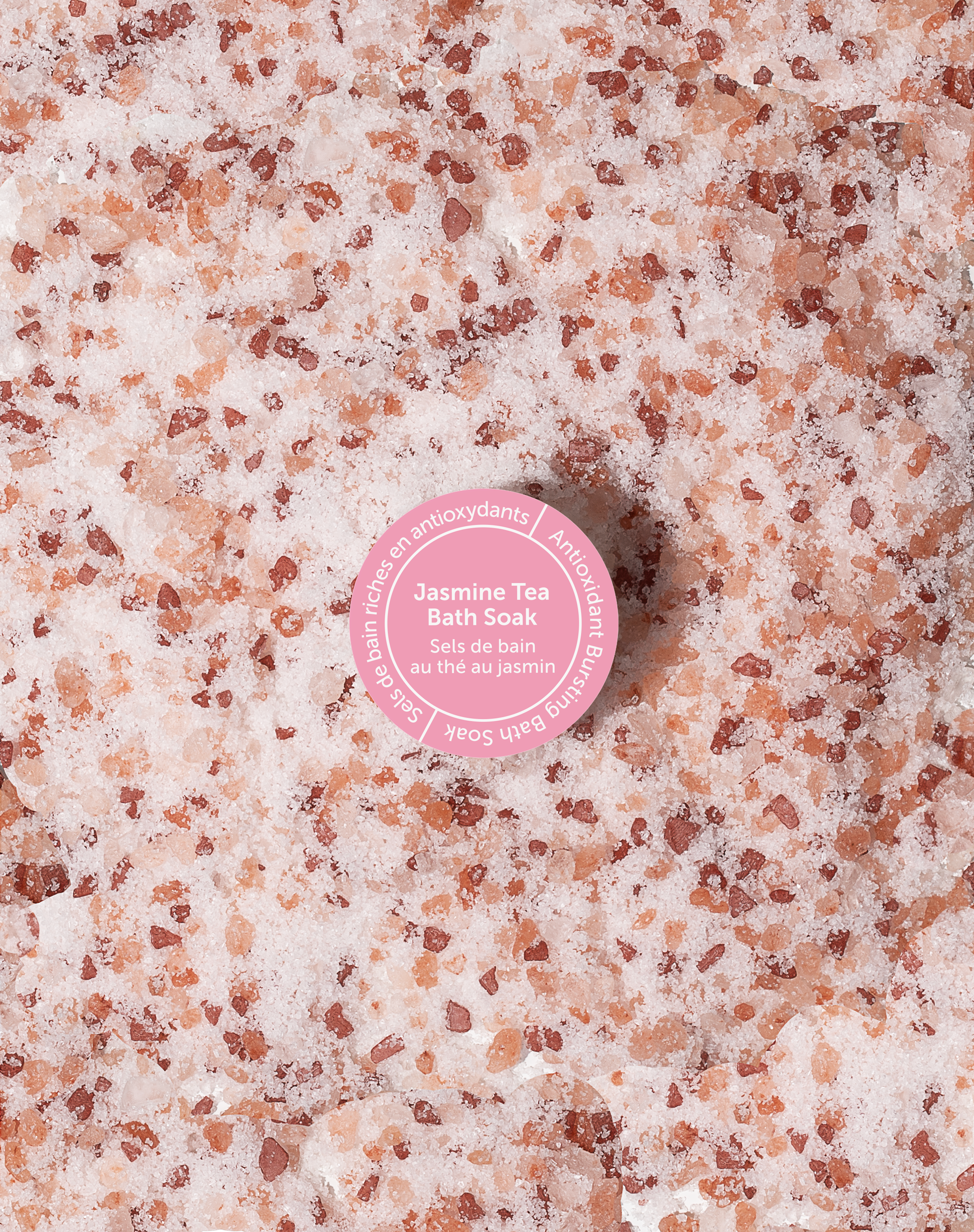 A package of Jasmine Tea Bath Soak with a pink and green label, placed against a neutral background.