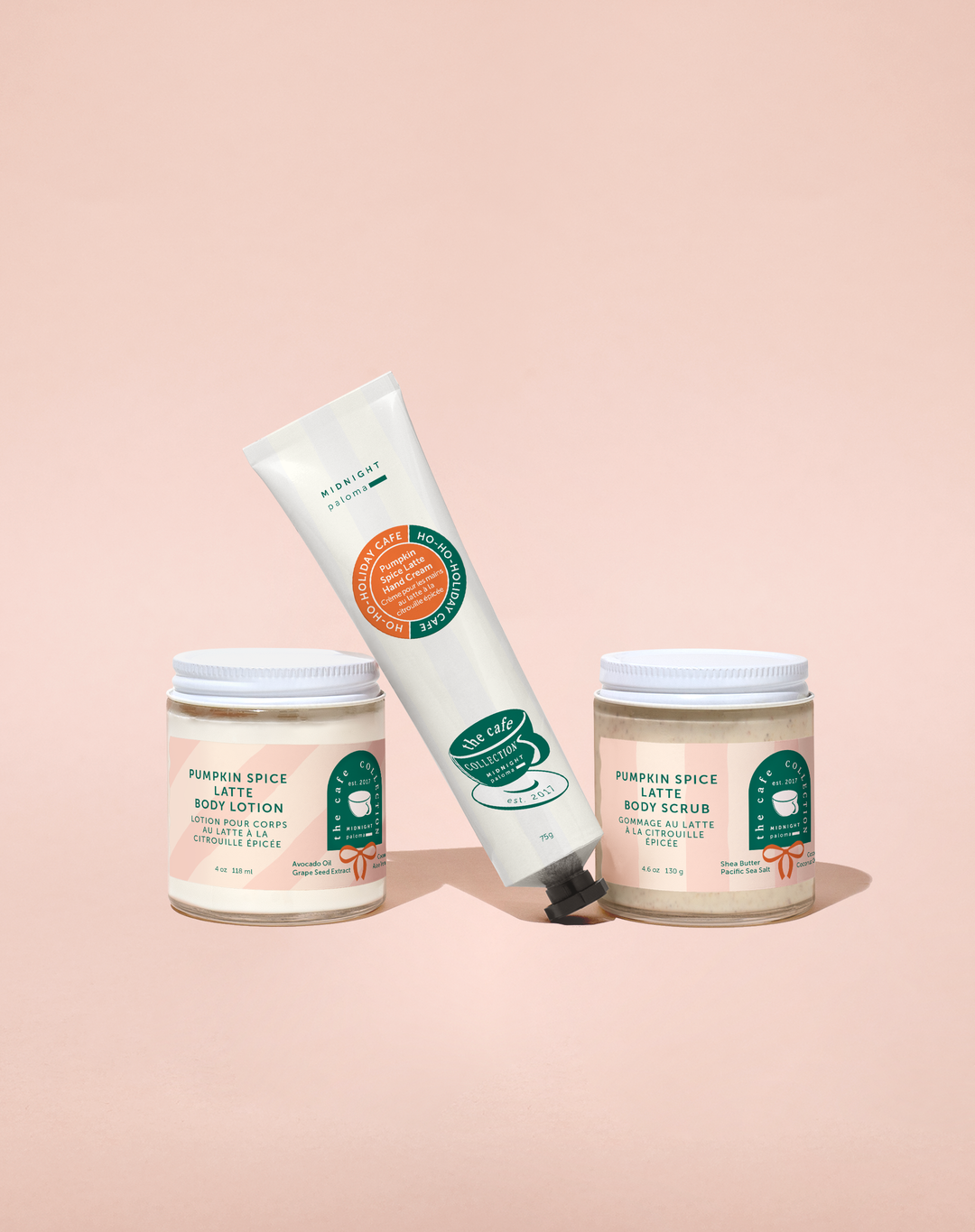 Three skincare products on a pink background