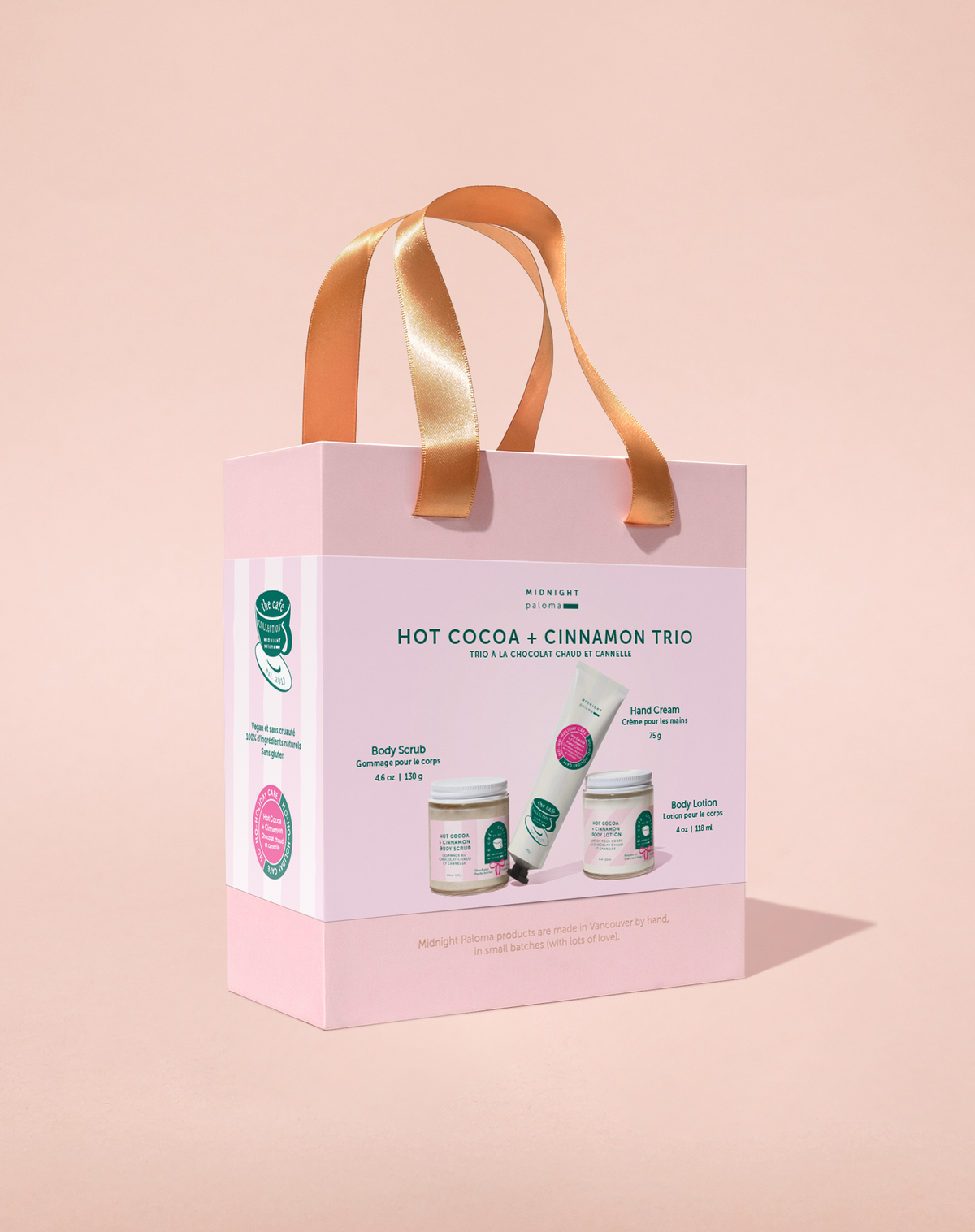 Gift set packaging with 'Hot Cocoa + Cinnamon Trio' on a beige background